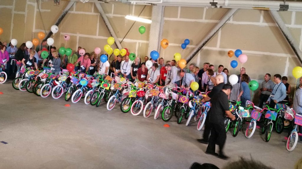 Sedgwick leadership teambuilding ‘Caring Counts’ activity building bikes to donate to The Boys and Girls Club.